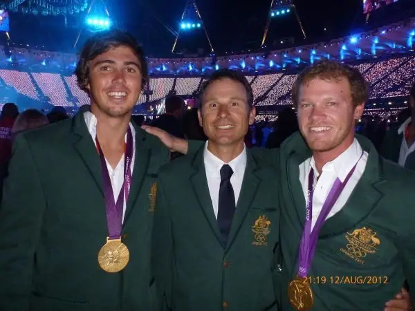 Nathan Outteridge and Iain Jensen with their coach and gold medals at the London 2012 stadium